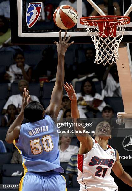 Allison Feaster of the Charlotte Sting tries to block the shot of Bernadette Ngoyisa of the Chicago Sky on August 12, 2006 at the Charlotte Bobcats...