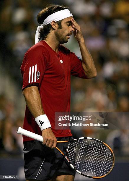 Fernando Gonzalez of Chile wipes his face while playing Roger Federer of Switzerland during the semifinals of the Toronto Masters Series Rogers Cup...