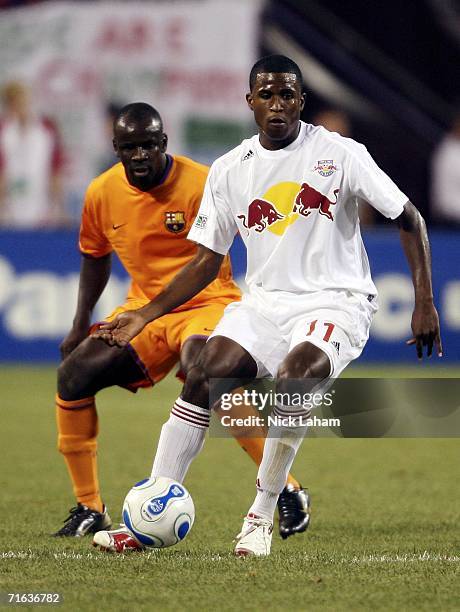 Edson Buddle of the New York Red Bulls passes in front of Lilian Thuram of FC Barcelona during their International Friendly Match on August 12, 2006...