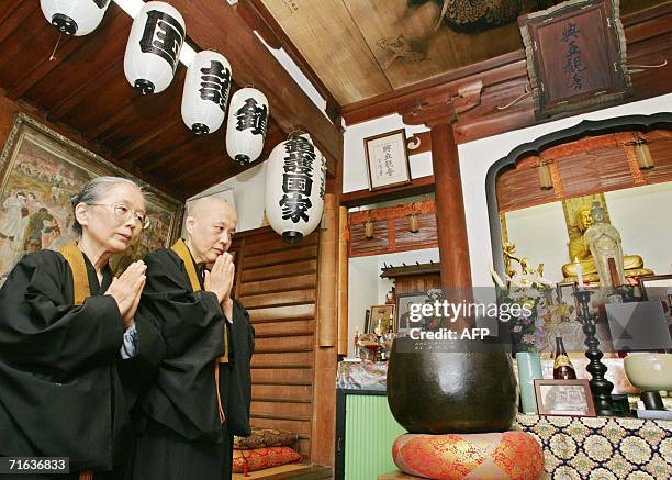 Two elderly nuns, elder sister Myotoku Itami and Myojo Itami, welcome visitors at the Koa Kannon temple in Atami, some 90km southwest of Tokyo, 27...