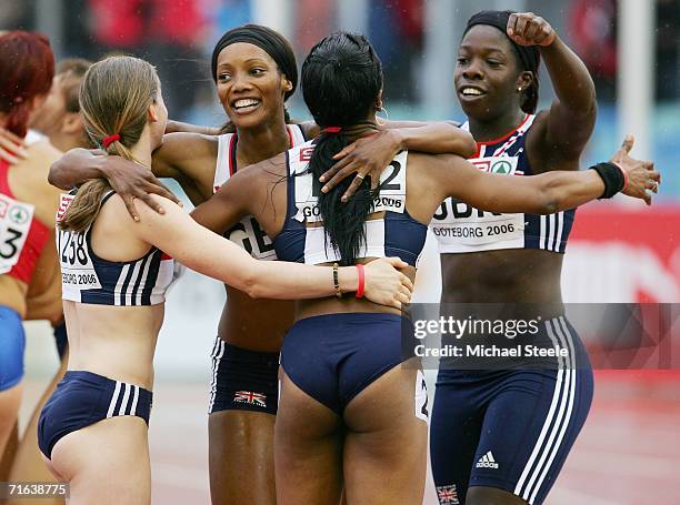 Team Great Britain members Emily Freeman, Emma Ania, Joice Maduaka and Anykia Onuora celebrate as they win silver during the Women's 4 x 100 Metres...