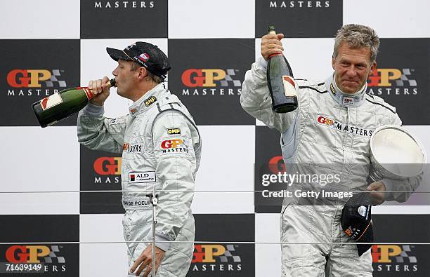 Eric van de Poele and Christian Danners celebrate on the podium after Eddie Cheever won the the GP Masters of Great Britain at Silverstone circuit on...