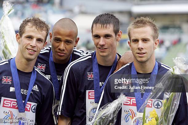 Robert Tobin,Rhys Williams, Graham Hedman and Tim Benjamin of Team Great Britain pose during the medal ceremony after they won silver during the...