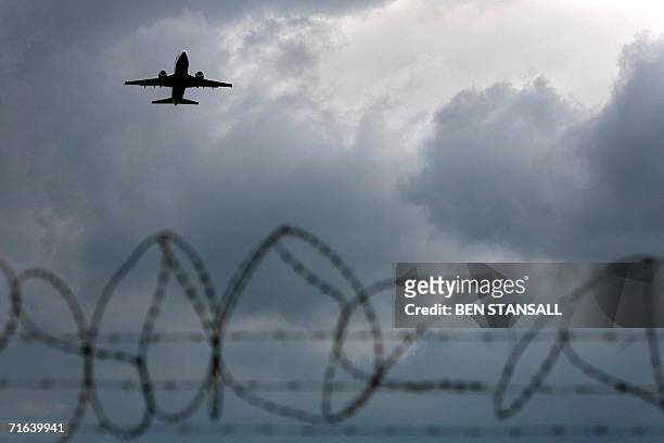 London, UNITED KINGDOM: An airplane is seen taking off from Gatwick Airport where air travel passengers have been delayed following new security...