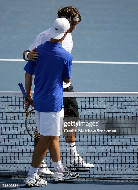 Richard Gasquet of France congratulates Roger Federer of Switzerland after the final of the Toronto Masters Series Rogers Cup on August 13, 2006 at...