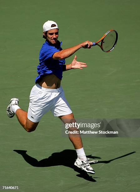 Richard Gasquet of France returns a shot to Roger Federer of Switzerland during the final of the Toronto Masters Series Rogers Cup on August 13, 2006...