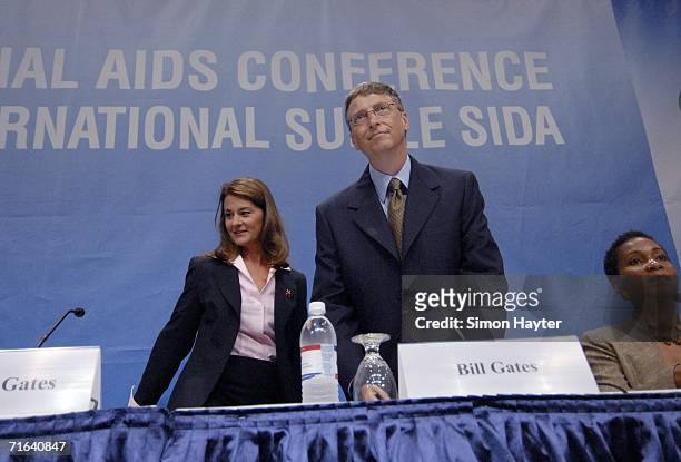 Bill and Melinda Gates, Co-chairs of the Bill and Melinda Gates Foundation, take their seats alongside Conference Co-chair Helene Gayle at the...