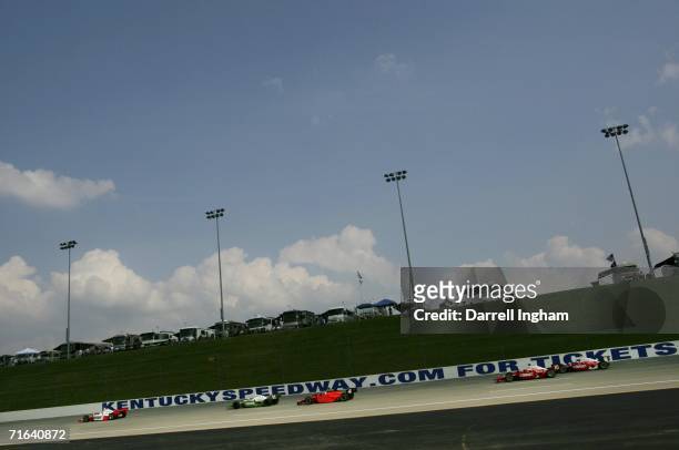Sam Hornish Jr. Drives the Marlboro Team Penske Dallara Honda ahead of Tony Kanaan, Vitor Meira and the two Target Ganassi Racing Dallara Hondas of...