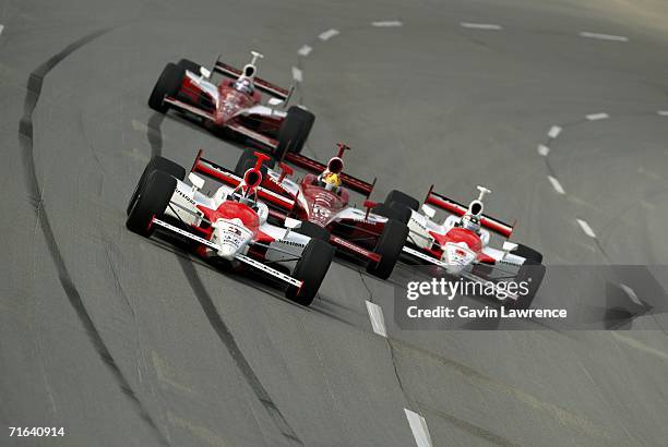 Helio Castroneves driver, of the Marlboro Team Penske Dallara Honda, leads Dan Wheldon, driver of the Target Ganassi Racing Dallara Honda, Sam...