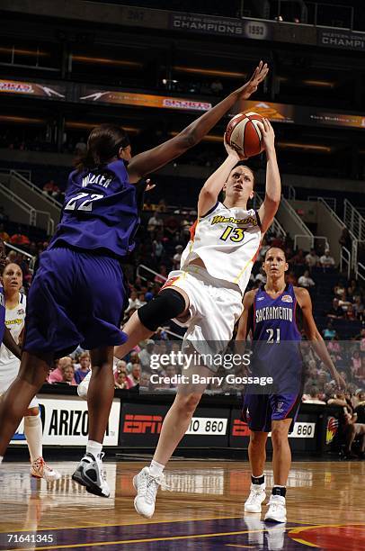 Penny Taylor of the Phoenix Mercury shoots the ball against DeMya Walker of the Sacramento Monarchs in a WNBA game played on August 13 at U.S....