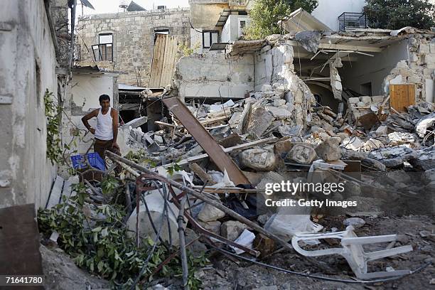 An Israeli Arab man stands in the ruins of a house, hit by a Katyusha missile the beginning of last week, August 14, 2006 in Haifa, Israel.Israel...