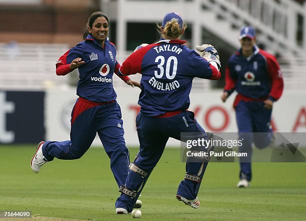 Isa Guha of England celebrates with Sarah Taylor after taking the wicket of Hemlata Kata of India during the first Natwest Women's International...