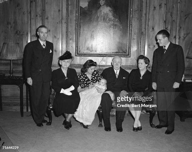 Portrait of the family of American socialite Rosamund Murray Byers as she holds her son, Buckley M Byers Jr and sits with, from left, her father...