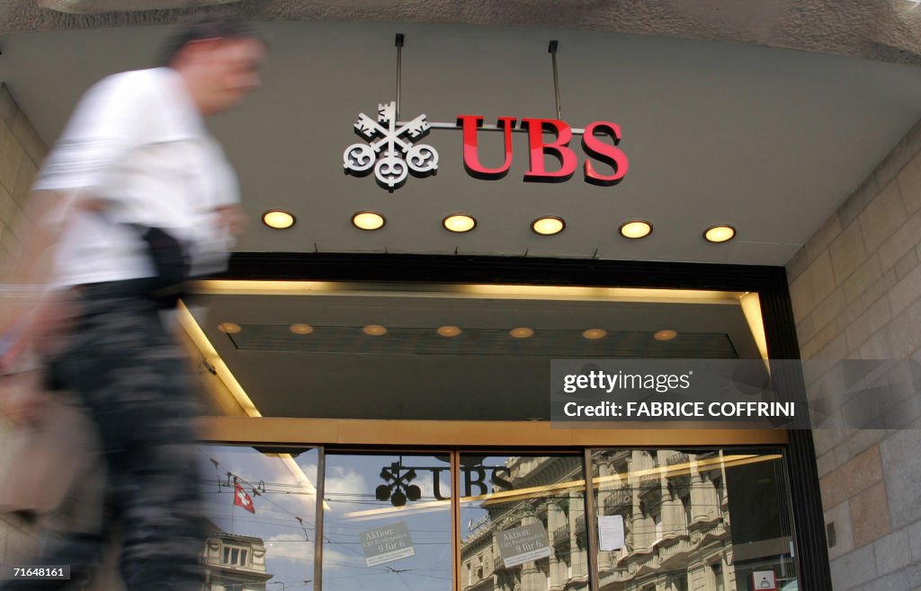 A man walks in front of the entrance of