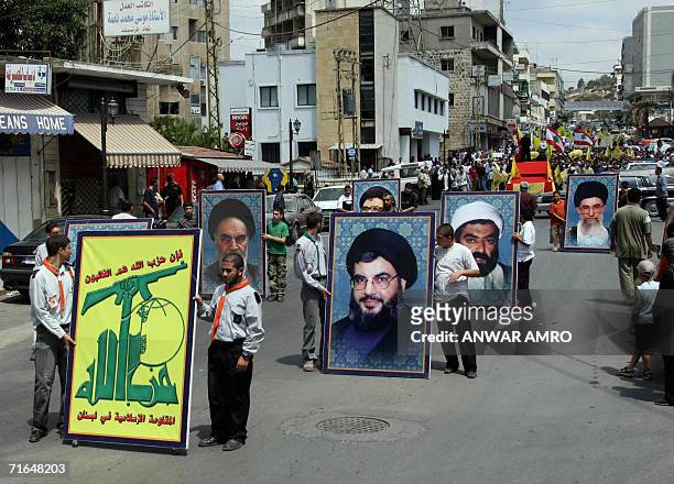 Hezbollah and Lebanese flags and portraits of Iranian and Lebanese Shiite Muslim clerics, including Hezbollah leader Hassan Nasrallah , are displayed...