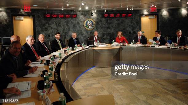 President George W. Bush meets with the Homeland Security team at the National Counterterrorism Center August 15, 2006 in McLean, Virginia. Seated to...