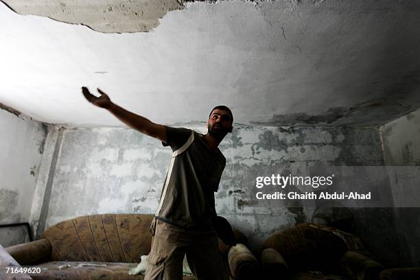 Hezbollah fighter stands in a bunker several kilometers away from the Lebanese Israeli border August 14, 2006 in Kheyam, Lebanon. The fighters were...