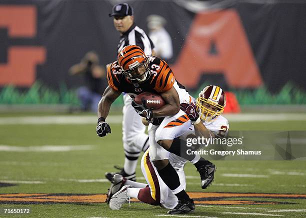 Reed Doughty of the Washington Redskins tackles Kenny Watson of the Cincinnati Bengals during the NFL preseason game on August 13, 2006 at Paul Brown...