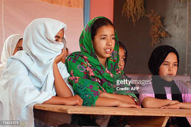 Young girls perform a play 05 August 2006 written by school teacher Mouloud Belfakir at a school of 23 pupils near Mirleft, southern Morocco....