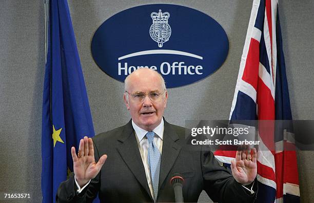 Britain's Home Secretary John Reid gestures as he holds a press conference along with European Union Commission Vice-President Franco Frattini and...
