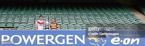 Paul Wellens of St Helens and Brad Drew, vice captain of Huddersfield Giants, pose with the Powergen cup during the Powergen Challenge Cup Final...