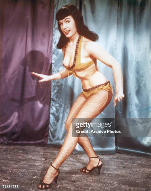 American glamour model and pin-up girl Bettie Page, circa 1955.