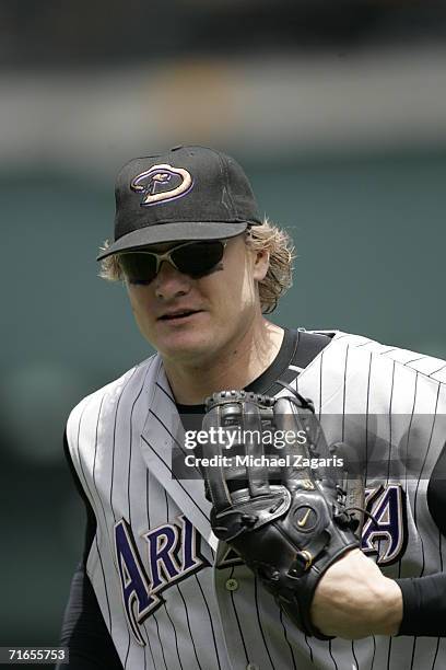 Eric Byrnes of the Arizona Diamondbacks fields against the Oakland Athletics at McAfee Coliseum in Oakland, California on July 2, 2006. The...