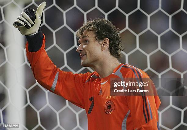 Goalkeeper Jens Lehmann of Germany celebrates winning the friendly match between Germany and Sweden at the Arena Auf Schalke on August 16, 2006 in...