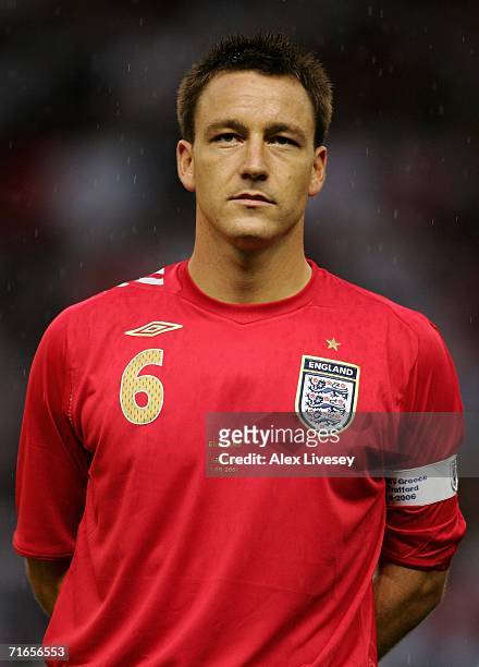 John Terry of England lines up for the national anthems prior to the International Friendly match between England and Greece at Old Trafford on...