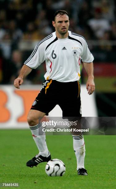 Jens Nowotny of Germany runs with the ball during the friendly match between Germany and Sweden at the Arena Auf Schalke on August 16, 2006 in...