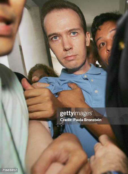 American John Mark Karr is held by U.S and Thai authorities at an immigration office on August 17, 2006 in Bangkok, Thailand. Karr has confessed to...