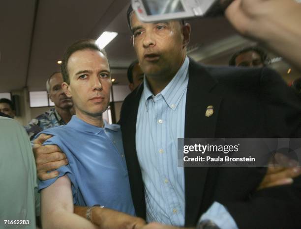 American John Mark Karr is held by U.S and Thai authorities at an immigration office on August 17, 2006 in Bangkok, Thailand. Karr has confessed to...