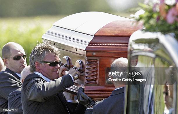 Darren Clarke carries the coffin of his wife Heather as it leaves Ballywillan Presbyterian Church on August 2006 in Portrush, Northern Ireland....