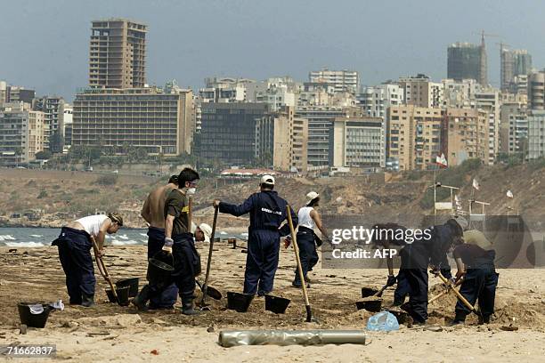 Mideast-conflict-Lebanon-environment-oil" Lebanese volunteers clean Ramlet el-Bayda beach in Beirut 17 August 2006. Armed only with shovels and...
