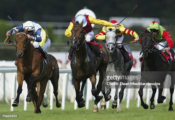 South O'The Border ridden by Ian Mongan leads the field to land The NEC Harlequins of London Handicap Stakes Race run at Sandown Park Racecourse on...