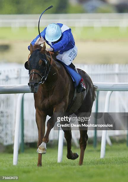 Meadow Mischief ridden by Ryan Moore leads the field to land The Oxshott Handicap Stakes Race run at Sandown Park Racecourse on August 17, 2006 in...