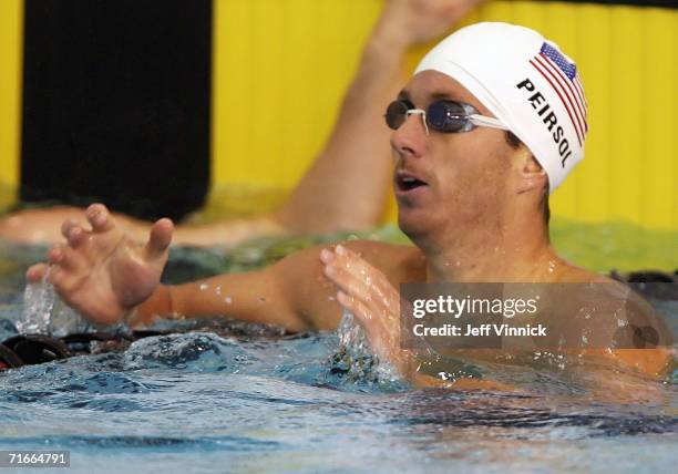 Aaron Peirsol of the U.S. Looks for his time after competing in the Men's 100m Backstroke at the Pan Pacific Swimming Championships August 17, 2006...