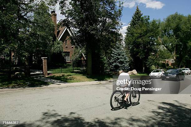 Youth rides a bicycle in front of the residence at 749 15th Street , where JonBenet Ramsey was murdered in December on August 17, 2006 in Boulder,...