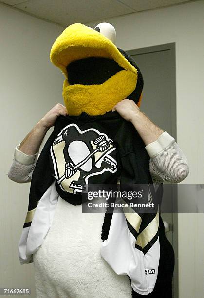 Mike Recktenwald changes into the Pittsburgh Penguins mascot "Iceburgh" before the Pittsburgh Penguins game against the New York Islanders on April...