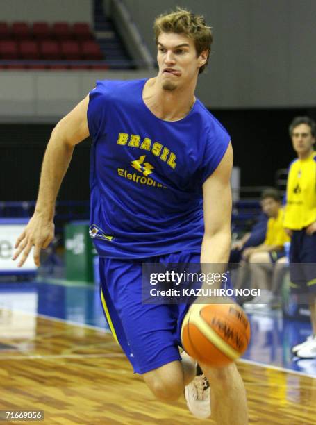 Brazilian basketball team power forward player Tiago Splitter dribbles the during an official practice session ahead of the World Basketball...