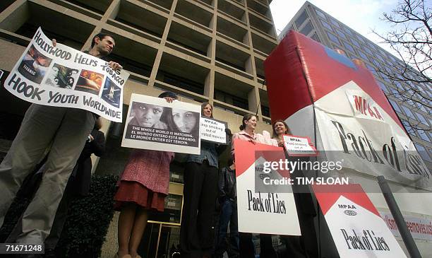Washington, UNITED STATES: In this 22 February file photo, volunteers with the Smokefree Movies Action Network protest outside the Washington...