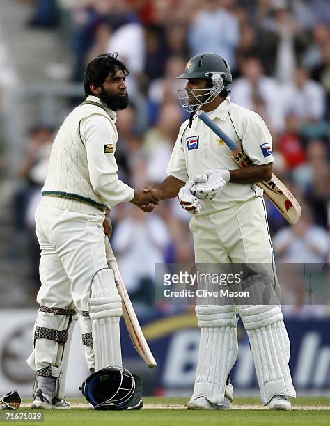 Mohammad Yousuf of Pakistan is congratulated by Mohammad Hafeez of Pakistan after scoring a century during day two of the fourth npower test match...