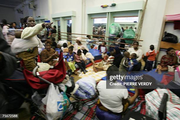 Dozens of families are relocated in a gymnasium after being evacuated from the makeshift camp where the residents who lived in a giant squat of the...