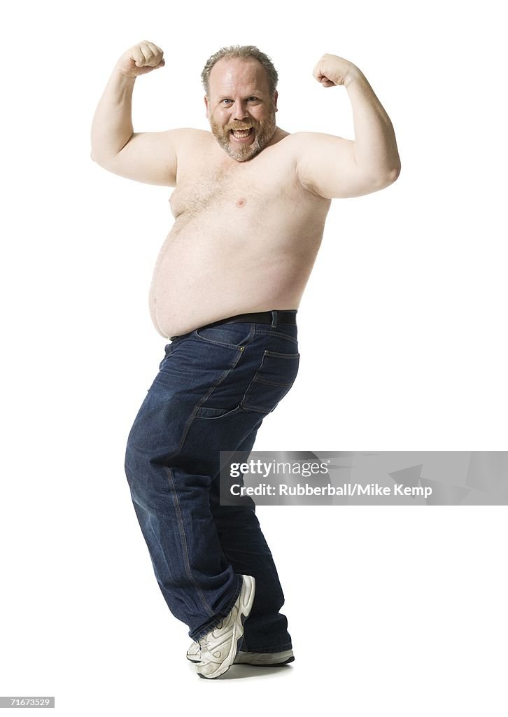 Portrait of a mature man flexing his muscles