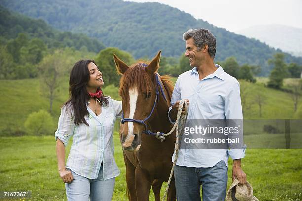 man and a woman with a horse - gateado imagens e fotografias de stock