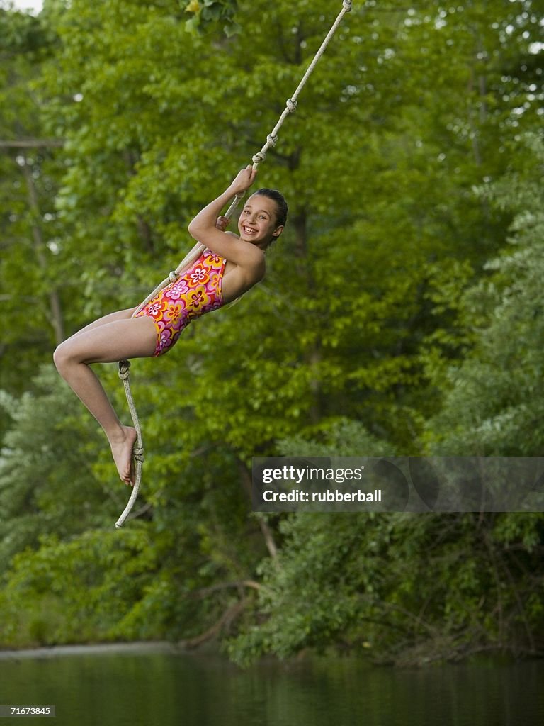 Swing The Rope Portrait Of A Girl Swinging On A Rope High-Res Stock Photo - Getty Images