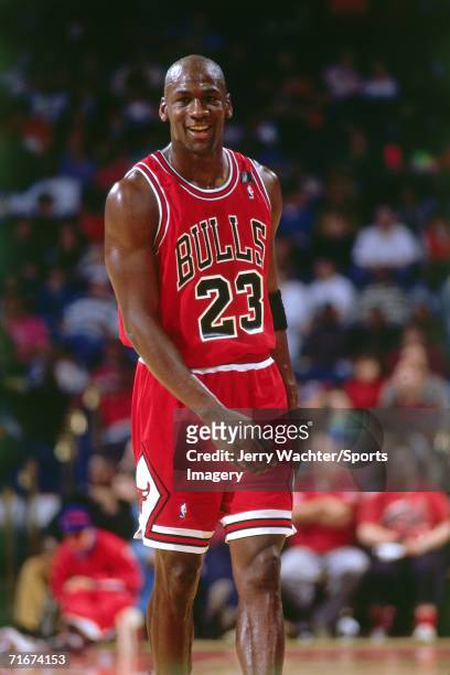 Michael Jordan of the Chicago Bulls walks on the court during a 1991 season game against the Washington Bullets at the Capital Centre in Landover,...