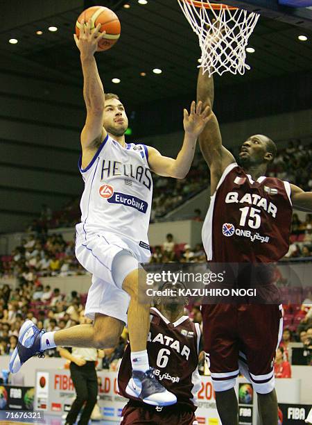 Greek point guard Vassilis Spanoulis attempts a basket as Omer Abgader Salem tries to block during their Group C opening match at the World...