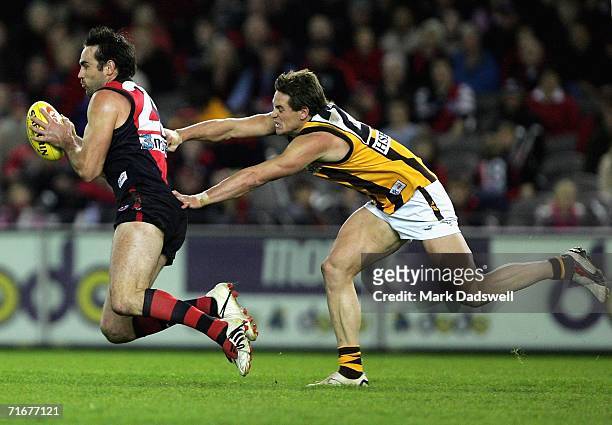 Scott Lucas of the Bombers marks ahead of Trent Croad of the Hawks during the round 20 AFL match between the Essendon Bombers and the Hawthorn Hawks...