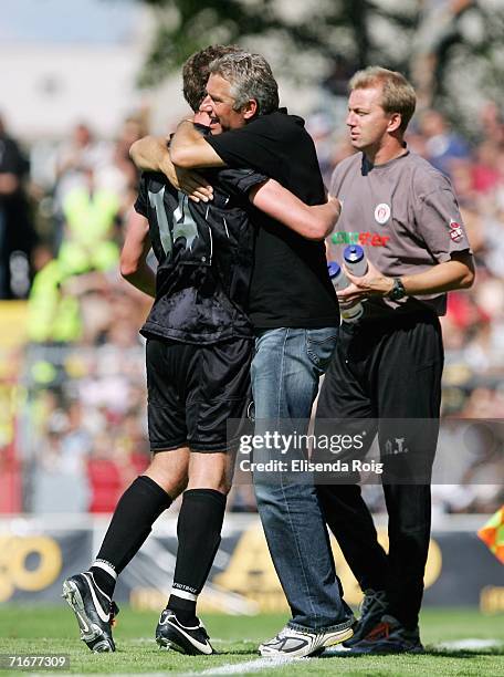 Coach Andreas Bergmann of Pauli celebrates the first goal with Marcel Eger of Pauli during the Third League match between FC St.Pauli and Werder...